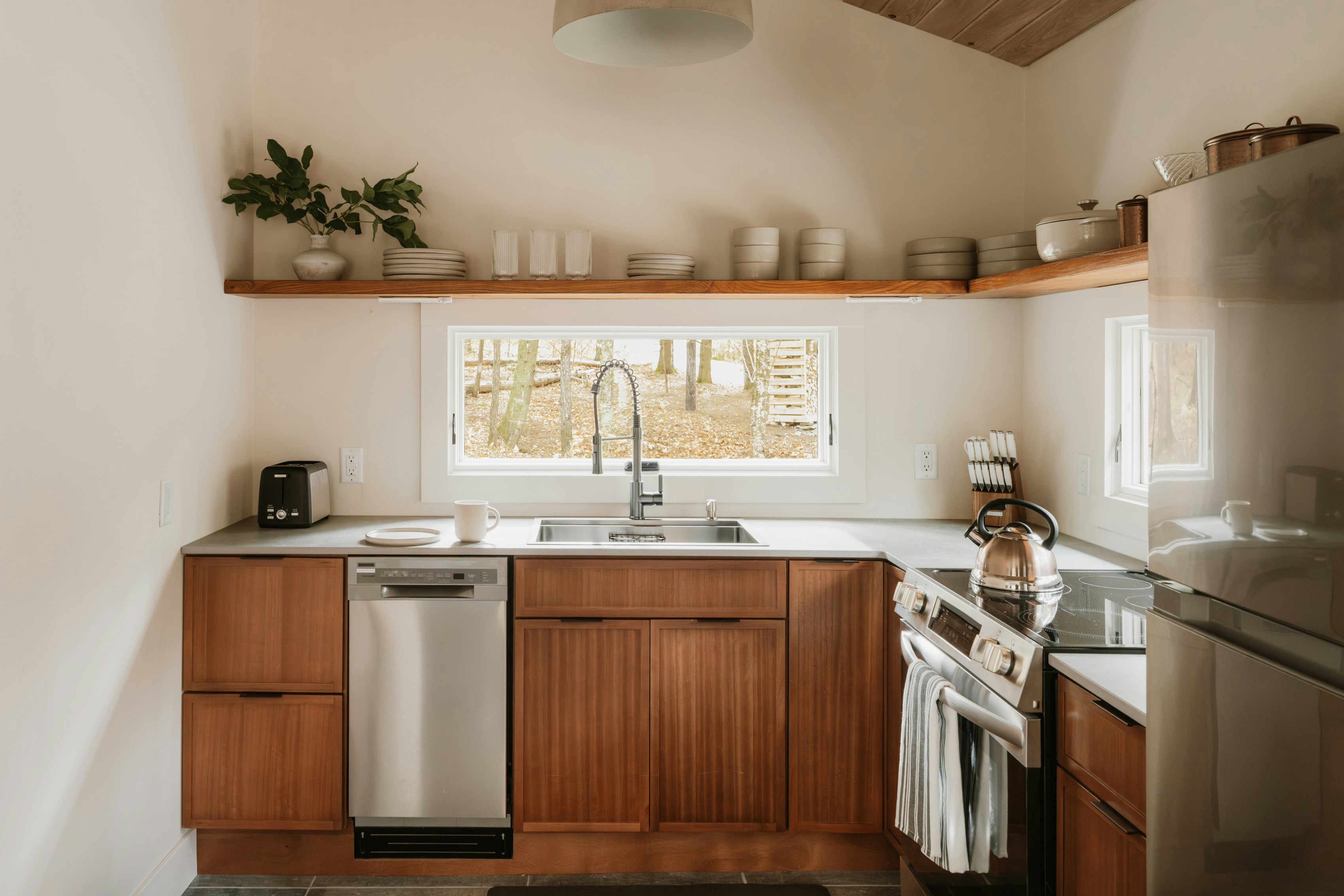 Bright kitchen space showing large-format tiled surfaces